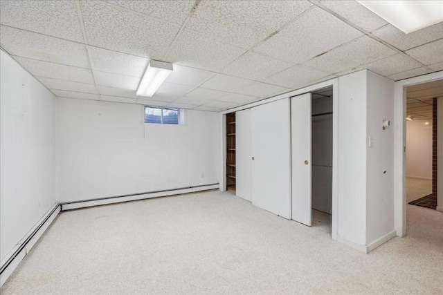 7 Wilbur Ct, Saugus, MA 01906 - basement featuring baseboard heating, a drop ceiling, and carpet floors