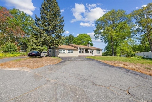 7 Wilbur Ct, Saugus, MA 01906 - view of front of home featuring driveway and a chimney
