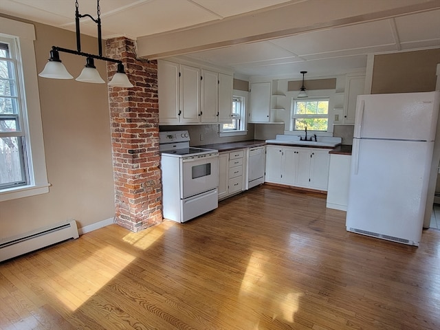 kitchen featuring white cabinets, white appliances, decorative light fixtures, and light hardwood / wood-style flooring