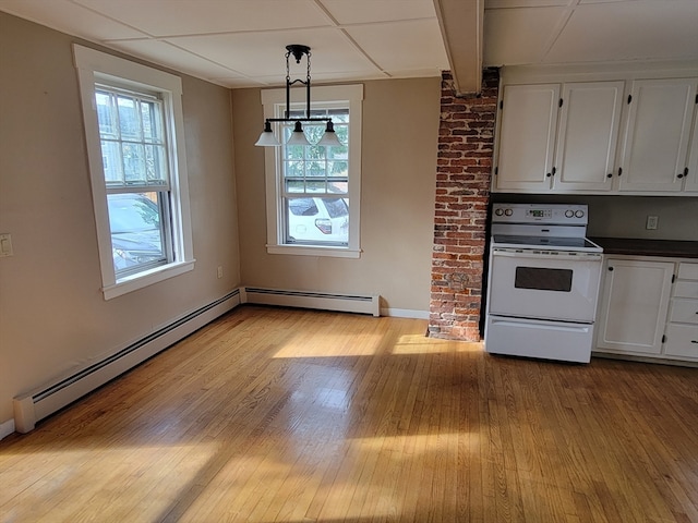 kitchen featuring a baseboard heating unit, white range with electric cooktop, white cabinets, light wood-type flooring, and decorative light fixtures