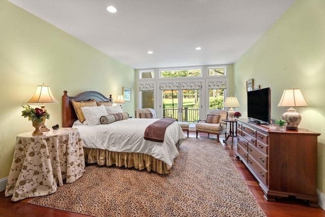 bedroom featuring dark wood-type flooring, access to outside, recessed lighting, and baseboards