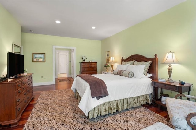 bedroom featuring dark wood-type flooring, baseboards, and recessed lighting