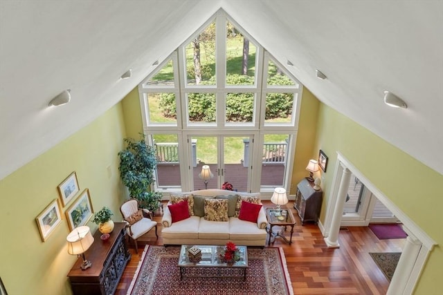 sunroom / solarium with french doors and lofted ceiling