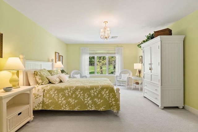 bedroom featuring light colored carpet, a chandelier, and baseboards