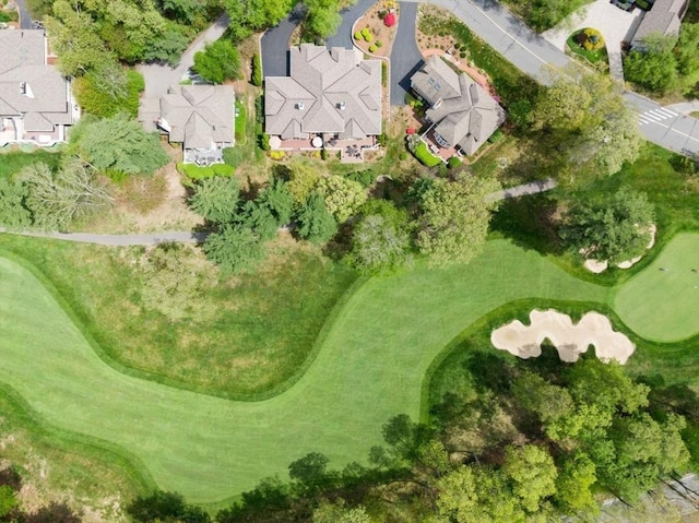 aerial overview of property's location with nearby suburban area and a golf club