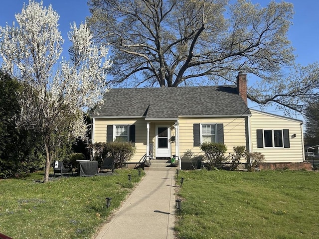 1 Stratford Rd, Holyoke, MA 01040 - view of front of house featuring a front lawn, a chimney, and roof with shingles