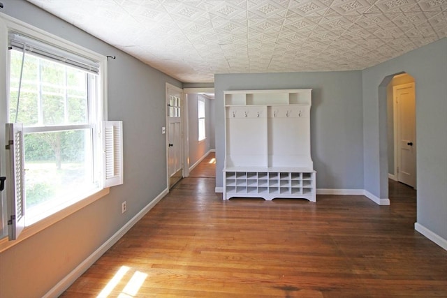 1 Stratford Rd, Holyoke, MA 01040 - foyer entrance with arched walkways, wood finished floors, baseboards, and an ornate ceiling