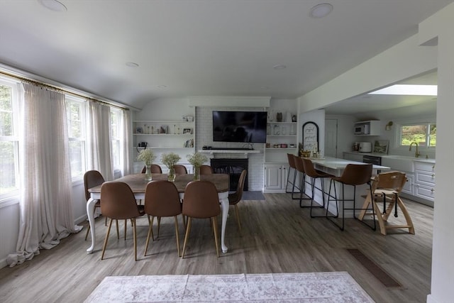 400 Loomis St, Westfield, MA 01085 - dining area with light wood finished floors and a brick fireplace