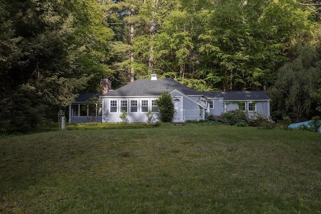 400 Loomis St, Westfield, MA 01085 - view of front of property with a front yard, a chimney, and a wooded view