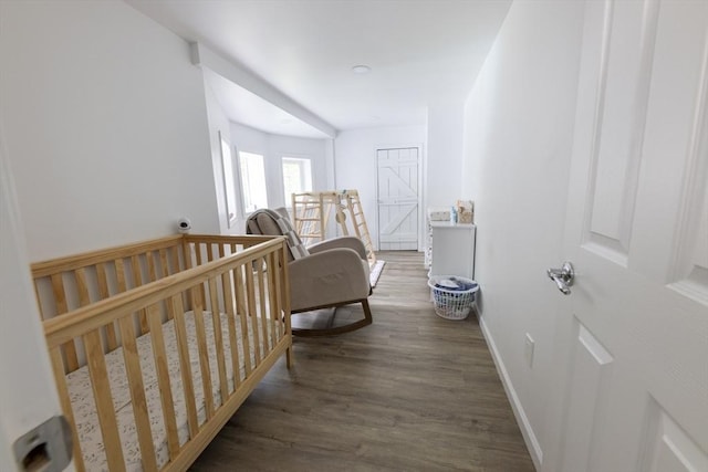 400 Loomis St, Westfield, MA 01085 - bedroom with wood finished floors, baseboards, and a nursery area