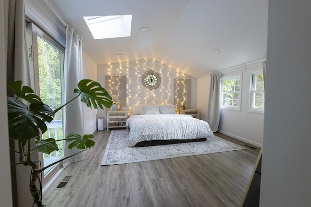 400 Loomis St, Westfield, MA 01085 - bedroom featuring vaulted ceiling, a skylight, wood finished floors, multiple windows, and baseboards