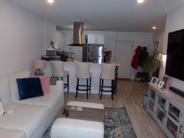 living room with light hardwood / wood-style floors