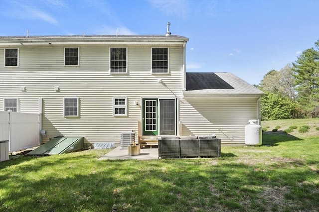 back of property featuring a patio, fence, a lawn, and an outdoor living space