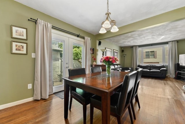 43 Endicott St Unit 43, Salem, MA 01970 - dining room with hardwood / wood-style floors and a chandelier