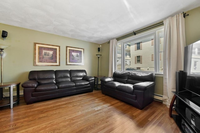 43 Endicott St Unit 43, Salem, MA 01970 - living area with wood finished floors and a baseboard heating unit
