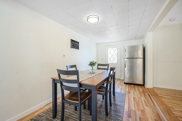 dining area with light hardwood / wood-style flooring