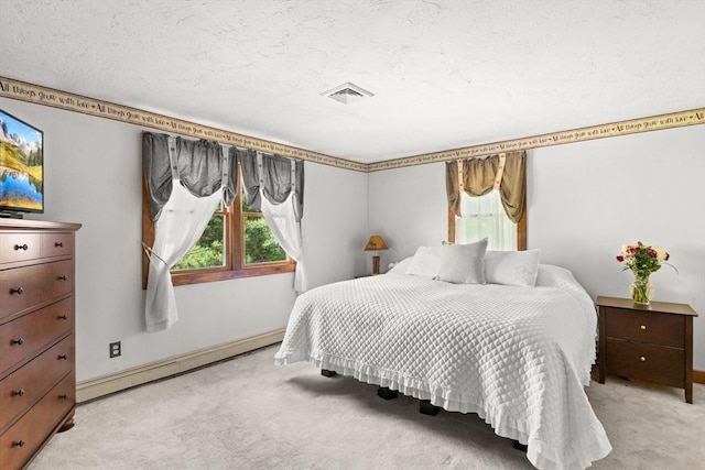 111 Esta Rd, Plymouth, MA 02360 - bedroom featuring light colored carpet, a baseboard heating unit, and baseboards