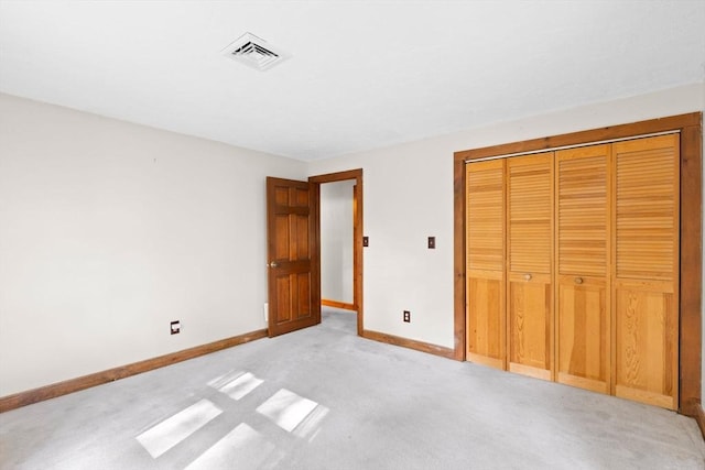 111 Esta Rd, Plymouth, MA 02360 - unfurnished bedroom featuring light carpet, baseboards, and a closet