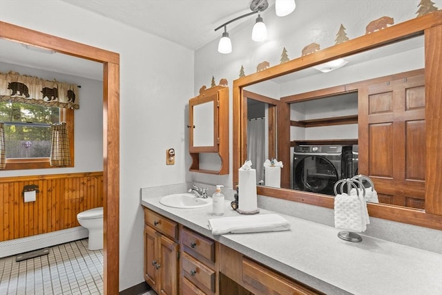 111 Esta Rd, Plymouth, MA 02360 - bathroom featuring toilet, vanity, wooden walls, a wainscoted wall, and tile patterned floors