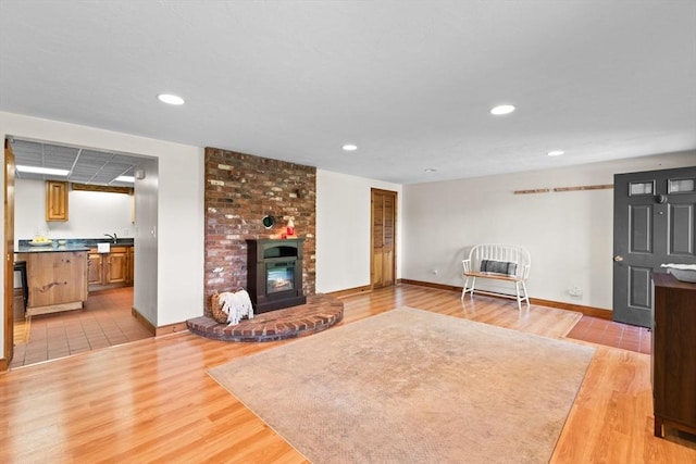 111 Esta Rd, Plymouth, MA 02360 - living area featuring light wood-type flooring, baseboards, a fireplace, and recessed lighting