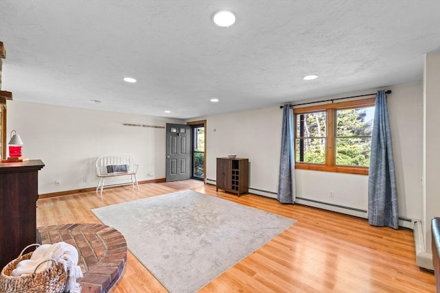 111 Esta Rd, Plymouth, MA 02360 - living area with light wood-type flooring, recessed lighting, baseboards, and baseboard heating