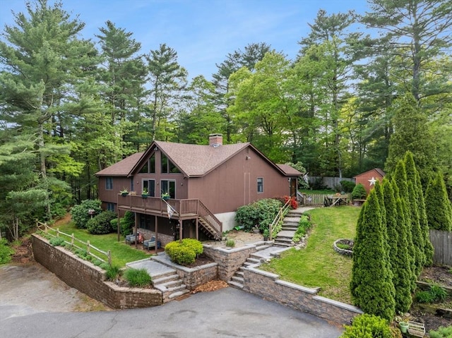111 Esta Rd, Plymouth, MA 02360 - view of front of house featuring stairway, a wooden deck, a chimney, asphalt driveway, and a shingled roof