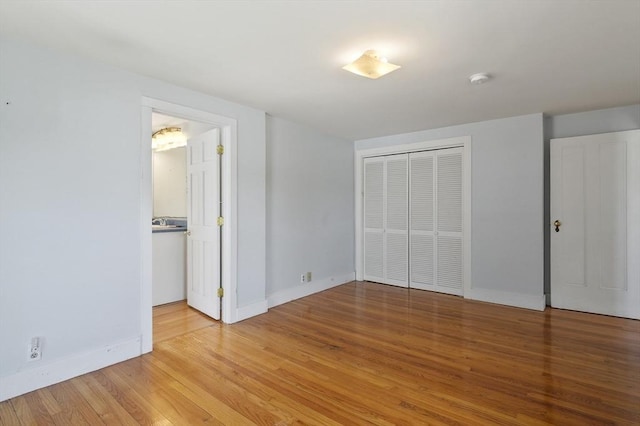270 Main St, Oxford, MA 01540 - unfurnished bedroom with baseboards, wood finished floors, and a closet