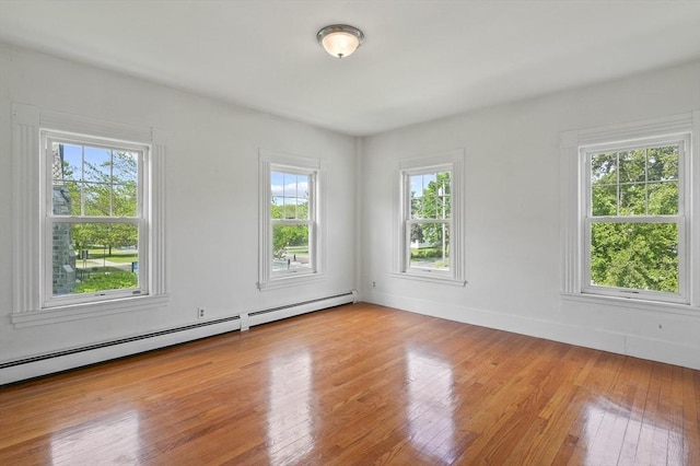 270 Main St, Oxford, MA 01540 - spare room featuring light wood-style flooring, a baseboard radiator, and baseboards