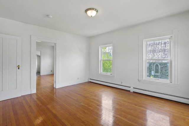 270 Main St, Oxford, MA 01540 - spare room featuring wood finished floors, baseboard heating, and baseboards