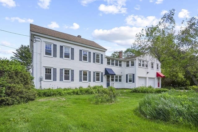 270 Main St, Oxford, MA 01540 - rear view of property featuring a chimney, an attached garage, and a lawn