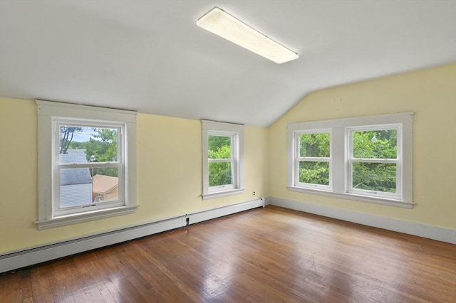 270 Main St, Oxford, MA 01540 - unfurnished room with a baseboard heating unit, vaulted ceiling, plenty of natural light, and wood finished floors