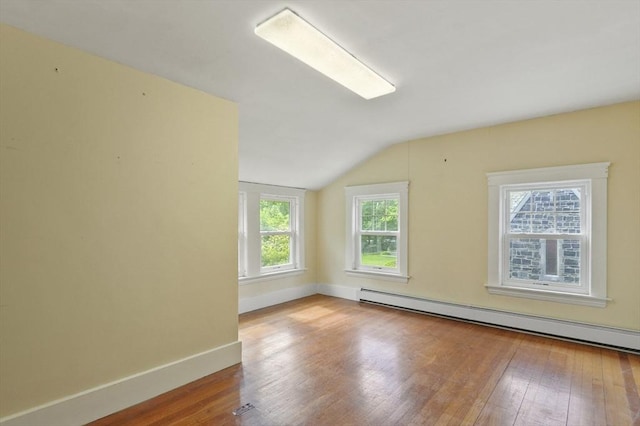 270 Main St, Oxford, MA 01540 - unfurnished room with baseboard heating, vaulted ceiling, wood-type flooring, and baseboards