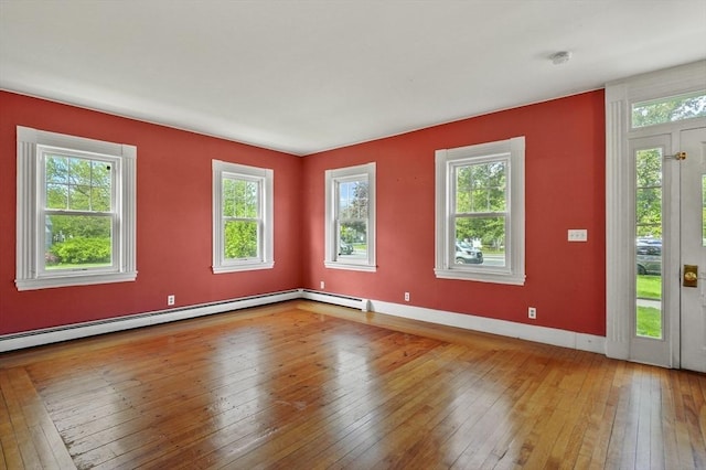 270 Main St, Oxford, MA 01540 - unfurnished room featuring hardwood / wood-style floors, a baseboard heating unit, a smoke detector, and baseboards