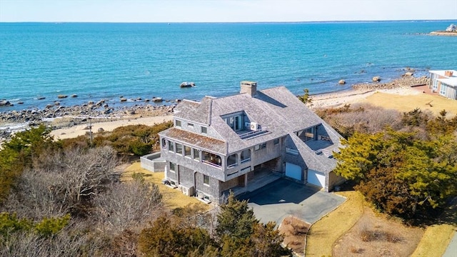 bird's eye view with a water view and a view of the beach