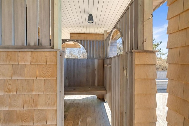 view of sauna / steam room with a healthy amount of sunlight and wood finished floors