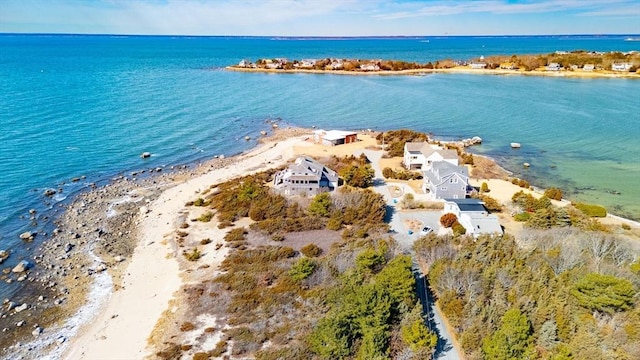 aerial view with a water view and a beach view