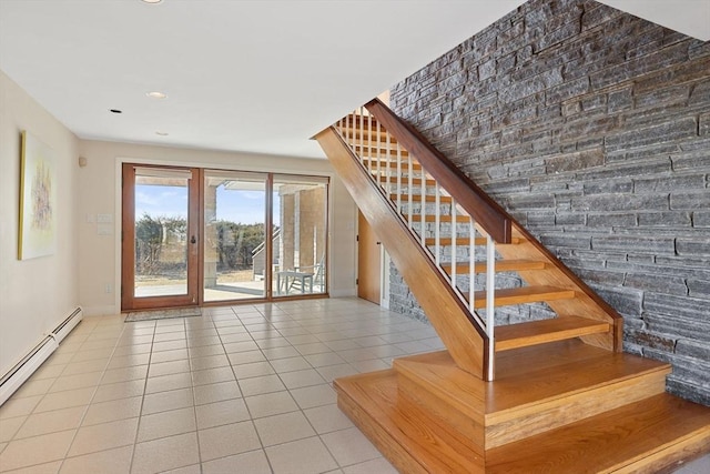 stairway featuring recessed lighting, baseboard heating, and tile patterned floors