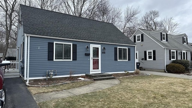 new england style home with a front yard