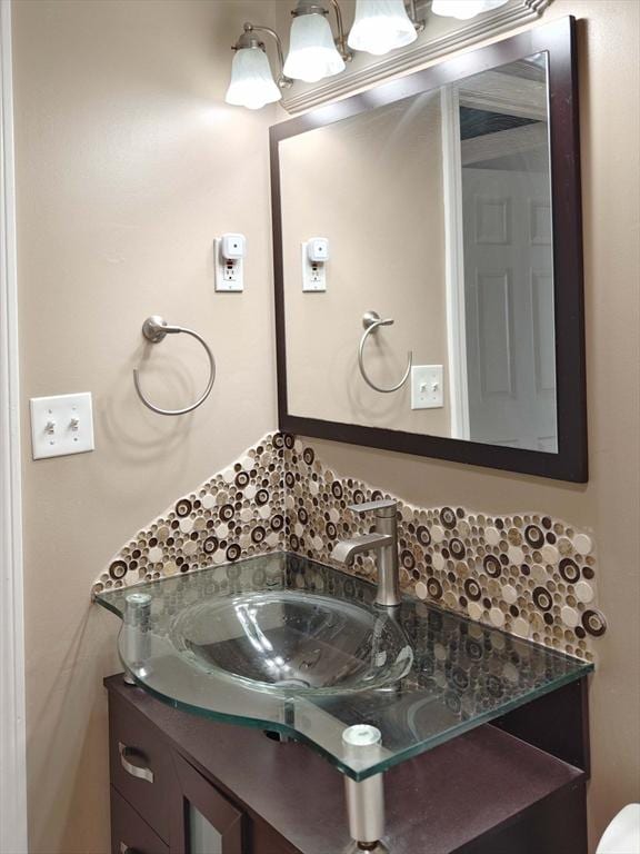 8 9th St Unit 406, Medford, MA 02155 - bathroom with decorative backsplash and vanity
