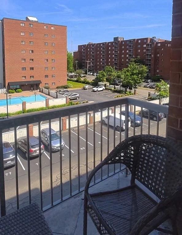 8 9th St Unit 406, Medford, MA 02155 - balcony featuring view of pool