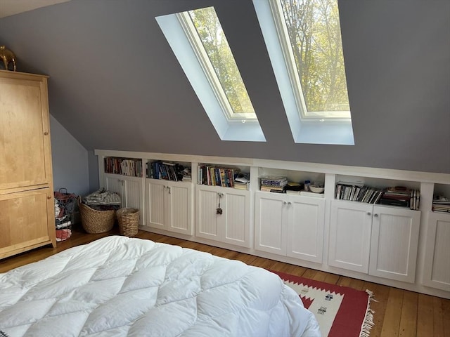 20 Rushmore St Unit 20, Boston, MA 02135 - bedroom with a skylight, lofted ceiling, and light wood-type flooring