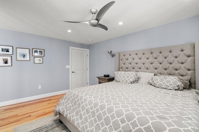 bedroom with a ceiling fan, baseboards, wood finished floors, and recessed lighting