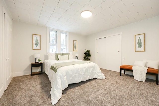 carpeted bedroom with a closet