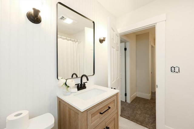 bathroom with vanity and toilet