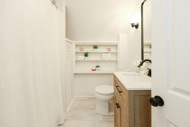 bathroom featuring vanity and toilet