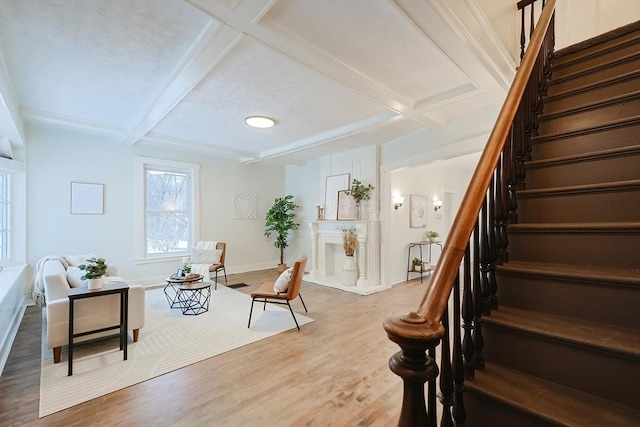 interior space with beamed ceiling, wood-type flooring, and coffered ceiling