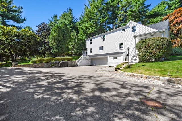 exterior space featuring a yard and a garage