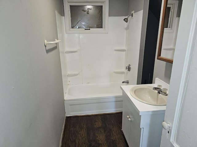 full bath with vanity,  shower combination, and wood finished floors