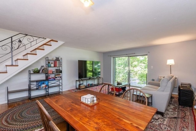 57 Saint Paul St Unit 19, Brookline, MA 02445 - dining area featuring wood finished floors, stairway, and baseboards