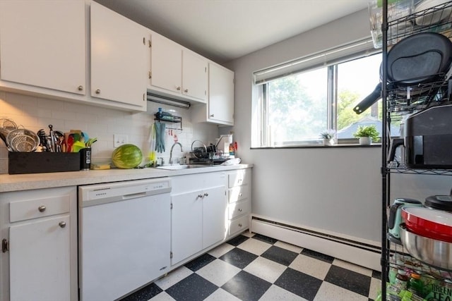 57 Saint Paul St Unit 19, Brookline, MA 02445 - kitchen featuring dishwasher, a baseboard heating unit, tile patterned floors, light countertops, and a sink